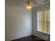Bright bedroom with a window, ceiling fan, and laminate flooring at 4454 Glenlea Commons Dr, Charlotte, NC 28216