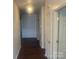 Inviting hallway with wood floors leading to various rooms in the home at 4454 Glenlea Commons Dr, Charlotte, NC 28216