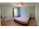 Comfortable bedroom featuring a large window and a ceiling fan for a relaxing atmosphere at 5009 Brook Valley Run, Monroe, NC 28110