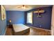Cozy bedroom with unique decor, including a model airplane and a view of the outdoors at 5009 Brook Valley Run, Monroe, NC 28110