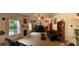 Cozy living room featuring a fireplace, plush carpet, and large windows, perfect for relaxation and entertainment at 5009 Brook Valley Run, Monroe, NC 28110