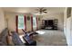Spacious living room with natural light, plush carpets, and a ceiling fan at 5009 Brook Valley Run, Monroe, NC 28110