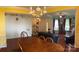 Bright and airy living area with a staircase, dark-stained hardwood floors and neutral paint tones at 5009 Brook Valley Run, Monroe, NC 28110