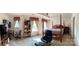 Spacious main bedroom with tray ceiling, four poster bed, desk, and large windows at 5009 Brook Valley Run, Monroe, NC 28110