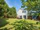 Backyard featuring a privacy fence, lawn, and patio seating at 5701 Silver Eagle Dr, Charlotte, NC 28214