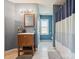 Bathroom featuring wood vanity, neutral tile floor, and a tub-shower combo at 5701 Silver Eagle Dr, Charlotte, NC 28214
