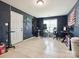 Large bonus room featuring tiled floor, natural light, and plenty of space for a home office and entertaining at 5701 Silver Eagle Dr, Charlotte, NC 28214