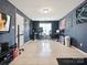 Large bonus room with tiled floor, natural light, and plenty of space for a home office and entertaining at 5701 Silver Eagle Dr, Charlotte, NC 28214