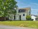 Side view of home highlighting its architectural details and well-maintained lawn at 5701 Silver Eagle Dr, Charlotte, NC 28214