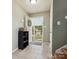 Bright foyer featuring tile flooring and a view of the outdoors through the front door at 5701 Silver Eagle Dr, Charlotte, NC 28214