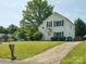 Charming home with well-manicured lawn and a long driveway at 5701 Silver Eagle Dr, Charlotte, NC 28214