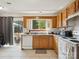 Well lit kitchen featuring tile flooring, a full appliance package, natural light, and a sliding glass door at 5701 Silver Eagle Dr, Charlotte, NC 28214