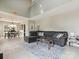 Open-concept living room with tile flooring and a comfortable sectional sofa and natural light at 5701 Silver Eagle Dr, Charlotte, NC 28214