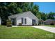 Charming single-story home with well-maintained lawn and mature trees in a desirable neighborhood at 5717 Fairchase Ave, Charlotte, NC 28269