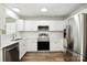 A kitchen featuring white cabinets, stainless steel appliances, and modern countertops at 5717 Fairchase Ave, Charlotte, NC 28269