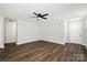 Spacious living room with hardwood floors, a ceiling fan, and plenty of room for furniture at 5717 Fairchase Ave, Charlotte, NC 28269