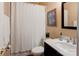 This bathroom offers a shower/tub combo, vanity and neutral colored walls at 7521 Plumcrest Ln, Harrisburg, NC 28075