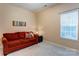 This bedroom features neutral colored walls, carpet and a large window at 7521 Plumcrest Ln, Harrisburg, NC 28075