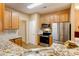 Well-equipped kitchen with stainless steel appliances and ample cabinet space at 7521 Plumcrest Ln, Harrisburg, NC 28075