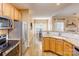 Bright kitchen with stainless steel appliances and breakfast nook at 7521 Plumcrest Ln, Harrisburg, NC 28075