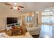 Spacious living room with hardwood floors and a cozy seating arrangement at 7521 Plumcrest Ln, Harrisburg, NC 28075