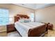 This main bedroom features a vaulted ceiling, and a large window allowing plenty of natural light at 7521 Plumcrest Ln, Harrisburg, NC 28075