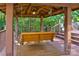 Relaxing porch swing inside a gazebo with wood flooring and stairs at 7521 Plumcrest Ln, Harrisburg, NC 28075