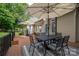 Spacious backyard deck offers ample seating and dining space, perfect for entertaining and enjoying the outdoors at 7988 Golf Course N Dr, Denver, NC 28037