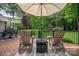 Backyard deck featuring comfortable seating, ideal for relaxing and enjoying the serene outdoor setting at 7988 Golf Course N Dr, Denver, NC 28037