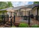 Backyard deck offering multiple seating arrangements and outdoor cooking for entertaining and relaxation at 7988 Golf Course N Dr, Denver, NC 28037