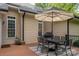 Backyard deck features a dining area and grill, creating an ideal setting for outdoor dining and entertainment at 7988 Golf Course N Dr, Denver, NC 28037