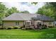 Spacious backyard boasts a large deck with ample seating and outdoor cooking area, ideal for entertainment at 7988 Golf Course N Dr, Denver, NC 28037