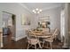 Cozy dining room features a round table, six chairs, and a decorative sideboard at 7988 Golf Course N Dr, Denver, NC 28037