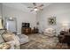 Spacious living room with high ceilings, a fireplace, and comfortable seating arrangements at 7988 Golf Course N Dr, Denver, NC 28037
