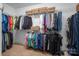 A spacious walk-in closet with ample storage, featuring rods and shelving for organizing clothing at 7988 Golf Course N Dr, Denver, NC 28037