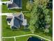 Aerial view of a home showcasing a well-manicured lawn, mature trees, and elegant outdoor living spaces at 920 Terramore Dr, Waxhaw, NC 28173