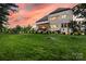 Expansive backyard featuring lush lawn and a covered patio, perfect for outdoor entertaining at 920 Terramore Dr, Waxhaw, NC 28173