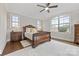 Bedroom with hardwood floors, area rug, dark wood furniture, and bright windows at 920 Terramore Dr, Waxhaw, NC 28173