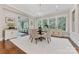 Elegant dining area with large windows providing abundant natural light and serene views at 920 Terramore Dr, Waxhaw, NC 28173
