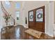 Elegant foyer with hardwood floors, a curved staircase, and decorative double doors at 920 Terramore Dr, Waxhaw, NC 28173