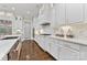 Bright kitchen with white cabinetry, quartz countertops, and stainless steel appliances at 920 Terramore Dr, Waxhaw, NC 28173