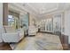 Bright and airy living room with large windows, hardwood floors, and stylish furniture at 920 Terramore Dr, Waxhaw, NC 28173