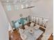 Bright, airy living room featuring tall ceilings, hardwood floors, and a wall of built-in shelving at 920 Terramore Dr, Waxhaw, NC 28173