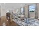 Open loft area with hardwood floors, a comfortable seating area, and decorative accents at 920 Terramore Dr, Waxhaw, NC 28173
