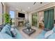 Inviting sunroom with a stone fireplace, mounted TV, and sliding glass doors to the outside at 920 Terramore Dr, Waxhaw, NC 28173