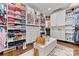 Spacious walk-in closet boasts custom shelving, ample storage, and a center island at 920 Terramore Dr, Waxhaw, NC 28173