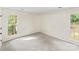 Bright bedroom with two windows offering natural light, and neutral carpet at 10016 Heathergate Ln, Mint Hill, NC 28227
