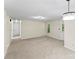 Spacious living room featuring new carpet, neutral paint, and modern lighting fixtures at 10016 Heathergate Ln, Mint Hill, NC 28227