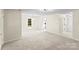 Expansive living room showcases new carpet and neutral walls, creating a bright and inviting atmosphere at 10016 Heathergate Ln, Mint Hill, NC 28227