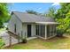 Charming home with a screened porch, fenced yard and neutral siding at 10016 Heathergate Ln, Mint Hill, NC 28227